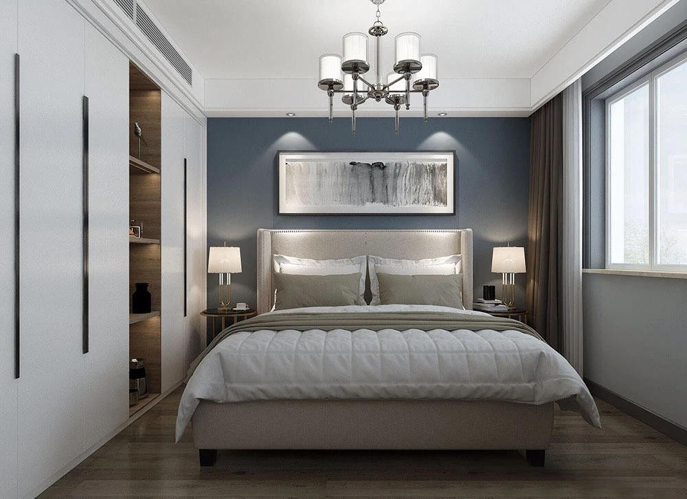 床头墙面采用质感很强的灰蓝色装饰,搭配一张灰色系布艺软包床架,配色